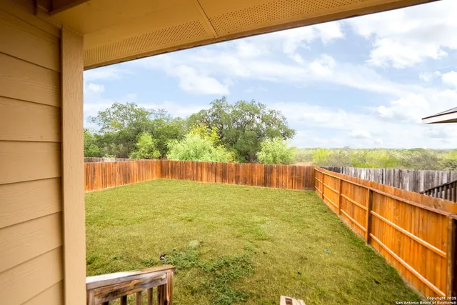 a view of balcony with yard