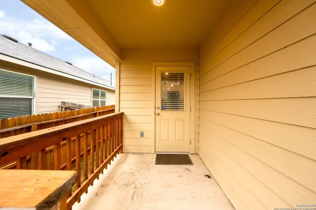 a view of balcony with wooden floor