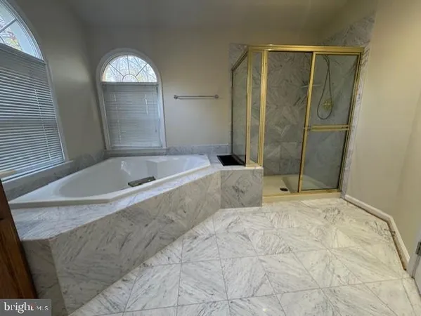 a bathroom with a double vanity sink and mirror