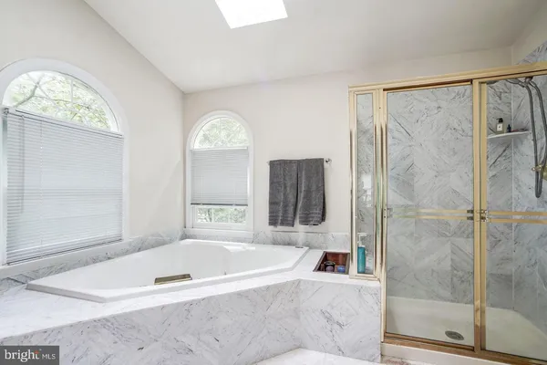 a bathroom with a sink mirror vanity and toilet