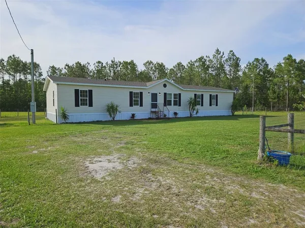front view of house with a yard