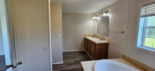 a bathroom with a sink a toilet and a shower