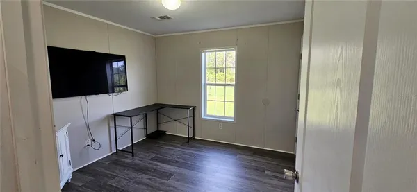a bathroom with a granite countertop toilet sink and a mirror