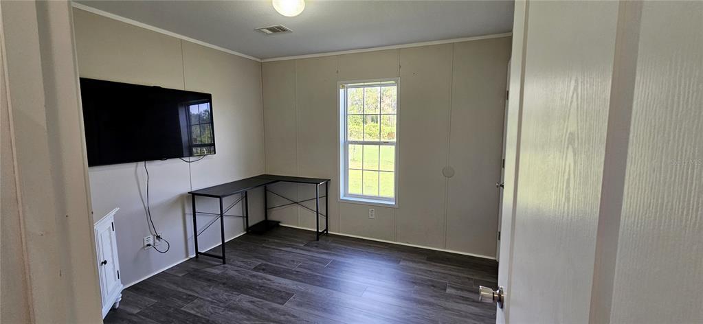 960 Still Road, Unit 1 Pierson, FL 32180 - Photo 29 of 67 a view of a hallway with wooden floor and staircase