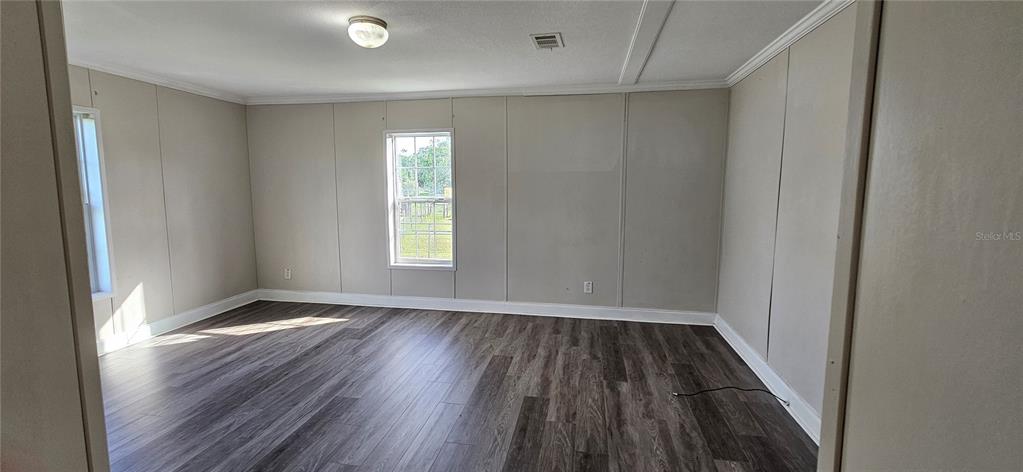 960 Still Road, Unit 1 Pierson, FL 32180 - Photo 34 of 67 wooden floor in an empty room with a window