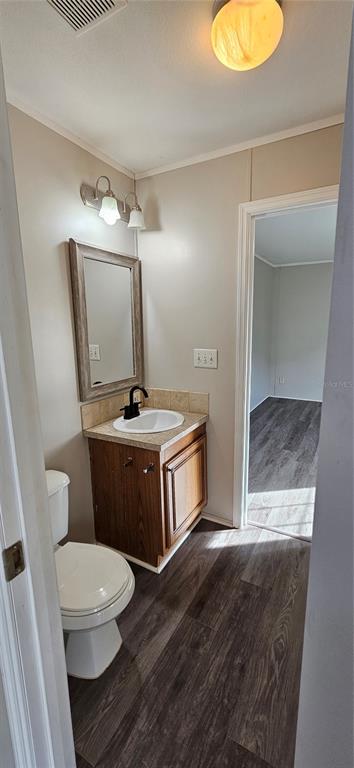 960 Still Road, Unit 1 Pierson, FL 32180 - Photo 37 of 67 a bathroom with a toilet a sink and mirror