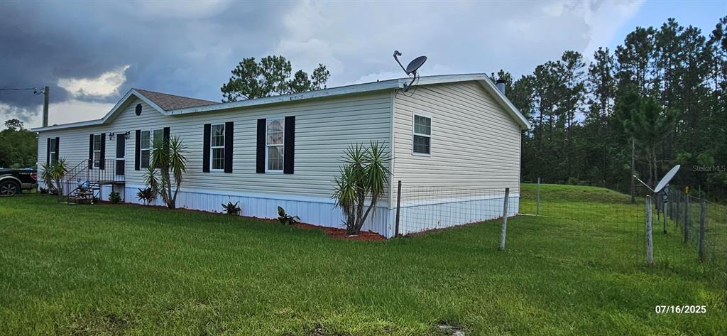 960 Still Road, Unit 1 Pierson, FL 32180 - Photo 43 of 67 a view of a house with a backyard