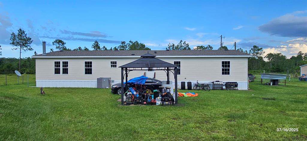 960 Still Road, Unit 1 Pierson, FL 32180 - Photo 45 of 67 a view of a house with backyard sitting area and garden