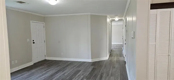 a living room with furniture and a bed