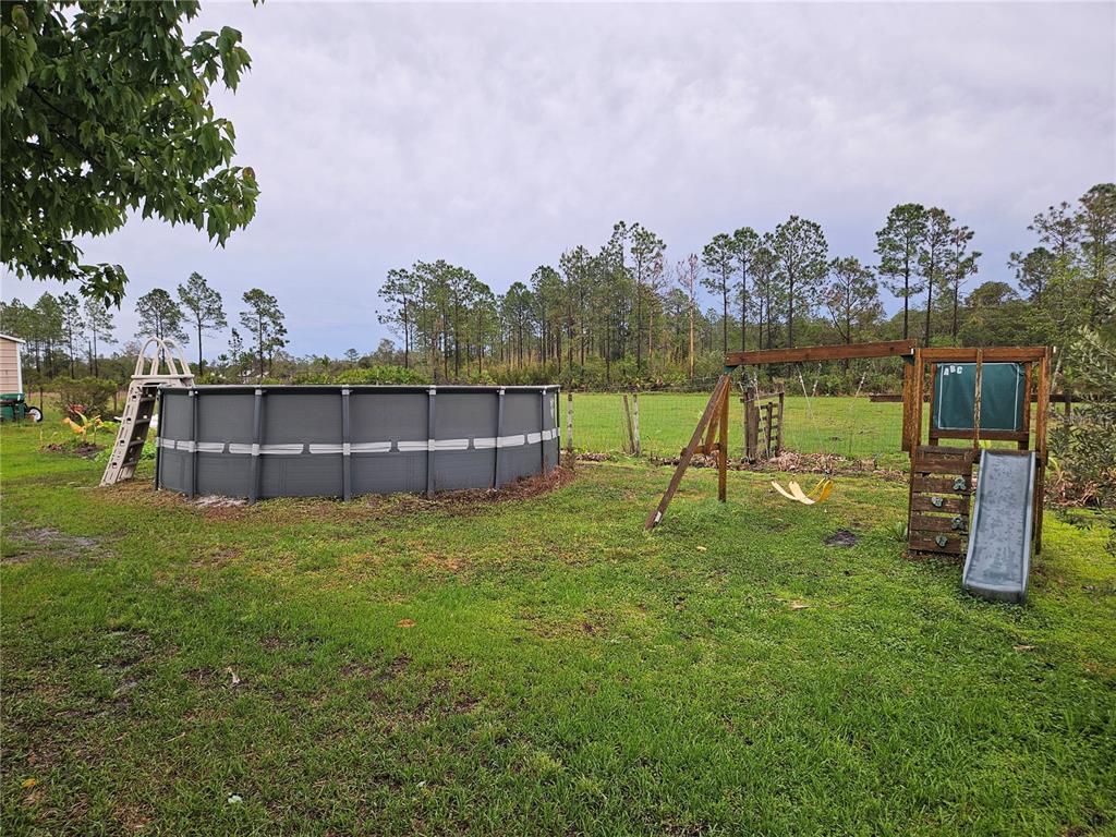 960 Still Road, Unit 1 Pierson, FL 32180 - Photo 55 of 67 a view of a garden with a house