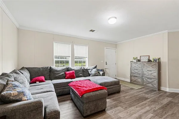 a kitchen with stainless steel appliances granite countertop a stove a sink and a wooden floors
