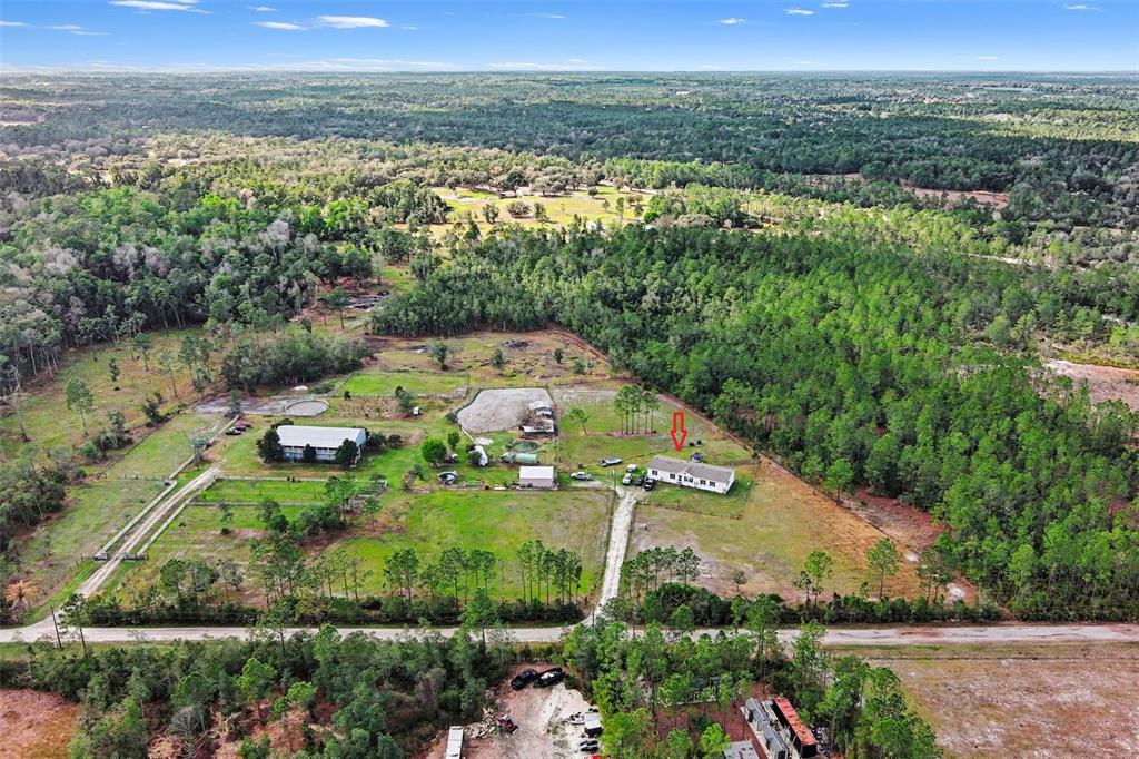 960 Still Road, Unit 1 Pierson, FL 32180 - Photo 65 of 67 an aerial view of a houses with a yard and lake view