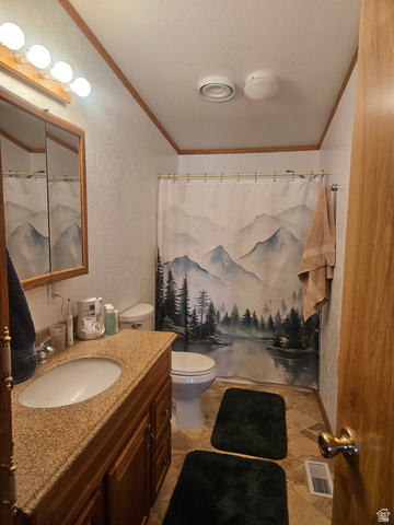 45758 Colt Road Fruitland, UT 84027 - Photo 2 of 21 Bathroom featuring a granite-look countertop, wood-finish vanity cabinetry, built-in sink, and ceramic tile flooring