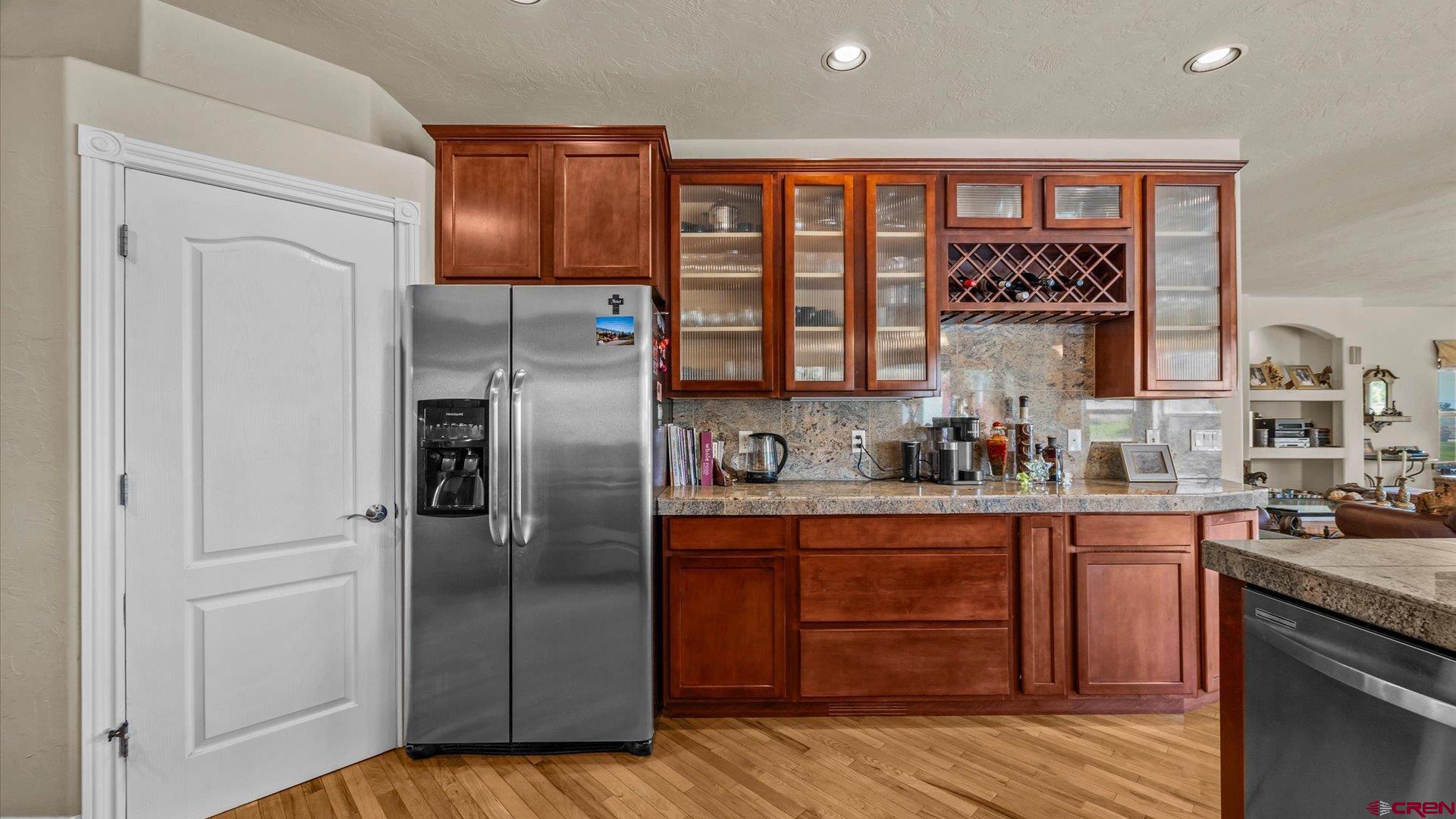 18222 6300th Road Montrose, CO 81403 - Photo 13 of 45 a kitchen with stainless steel appliances granite countertop a refrigerator and a sink