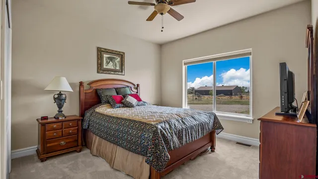 a bedroom with a bed and a table