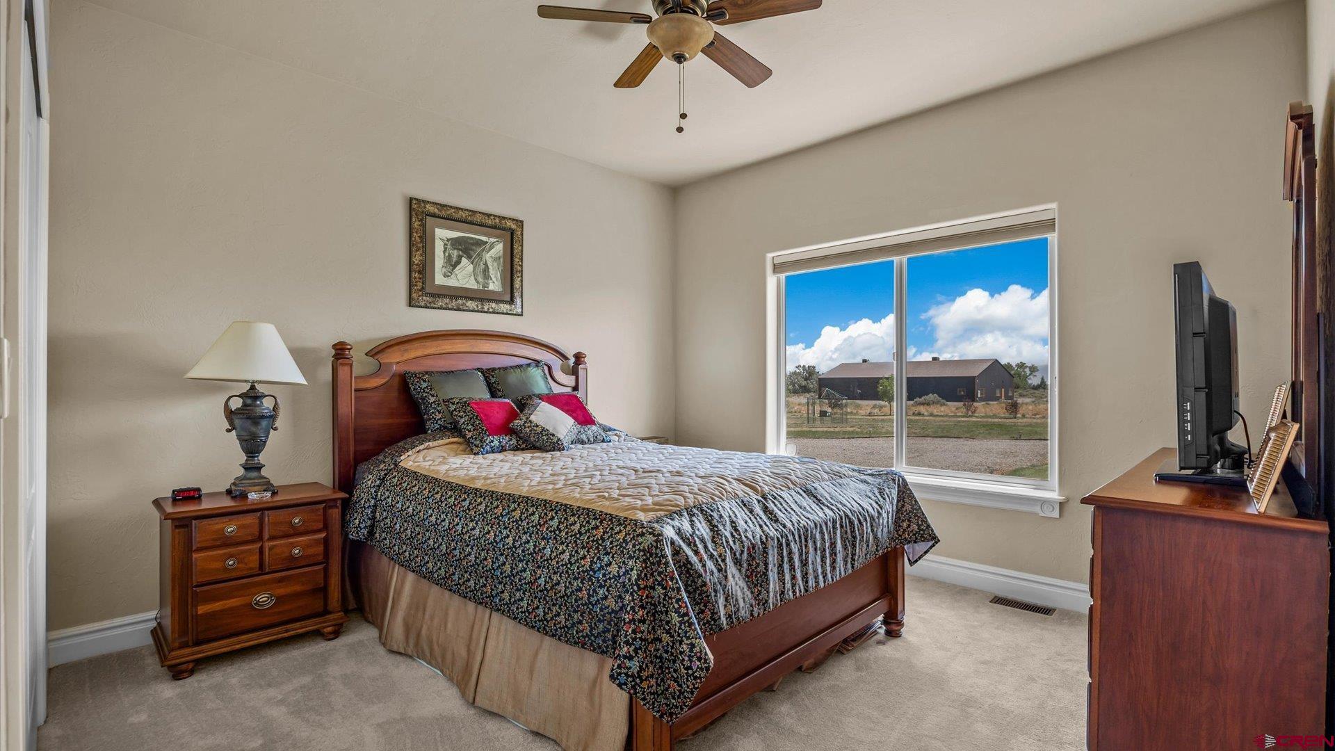 18222 6300th Road Montrose, CO 81403 - Photo 19 of 45 a bedroom with a bed and a table