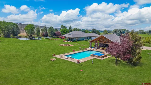 a view of a house with a big yard