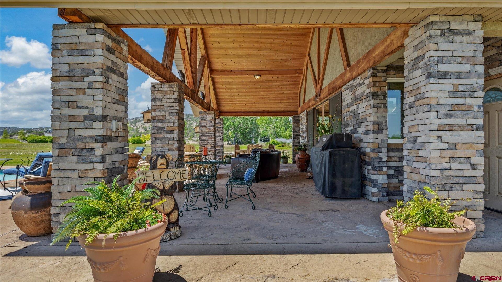 18222 6300th Road Montrose, CO 81403 - Photo 28 of 45 a view of a patio with plants and chairs