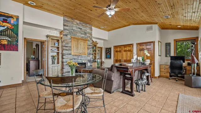 a dining room with furniture and window