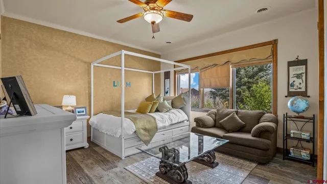 a bedroom with furniture and a window