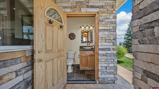 a view of a door of the house with a street