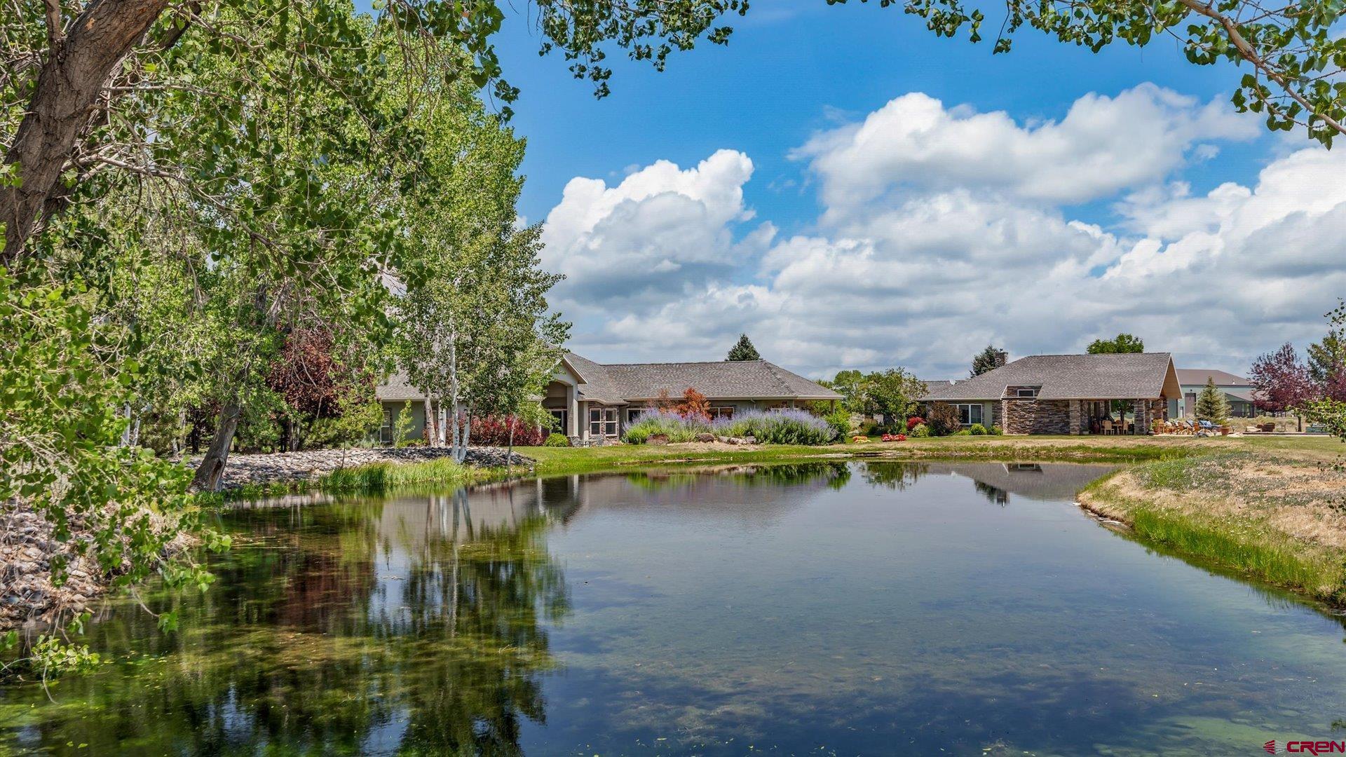 18222 6300th Road Montrose, CO 81403 - Photo 4 of 45 a view of a lake with houses