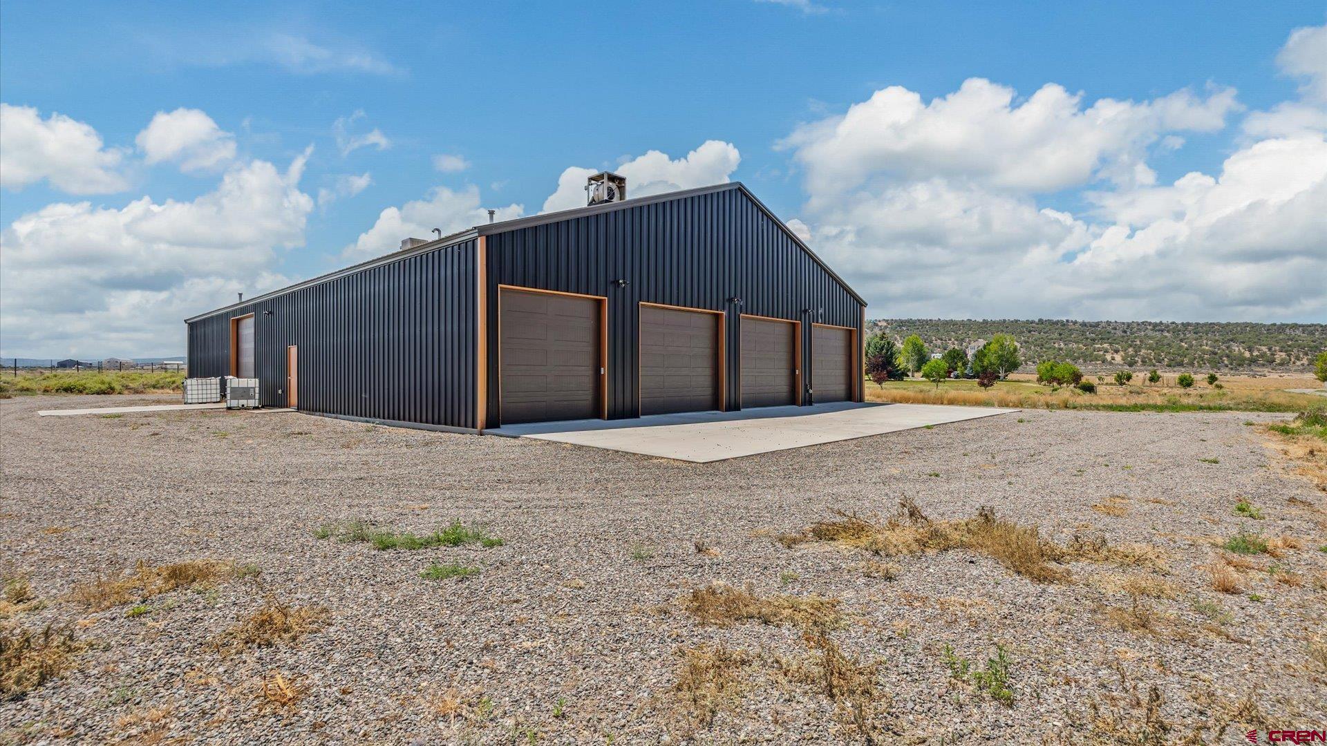18222 6300th Road Montrose, CO 81403 - Photo 41 of 45 a view of a wooden house with a yard