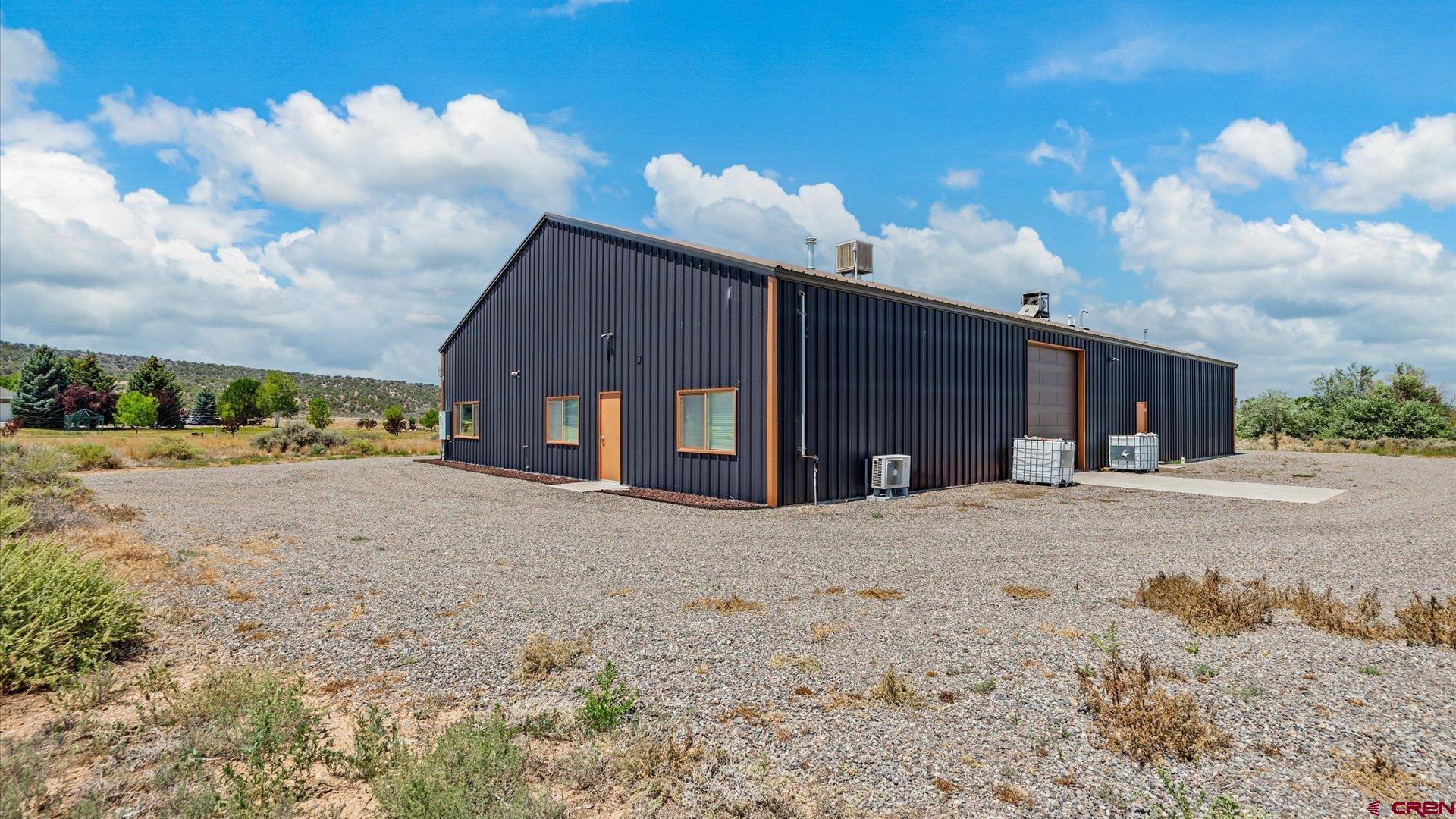 18222 6300th Road Montrose, CO 81403 - Photo 42 of 45 a view of a house with a yard