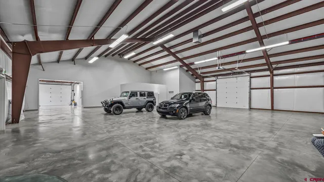 a view of a garage with parked cars