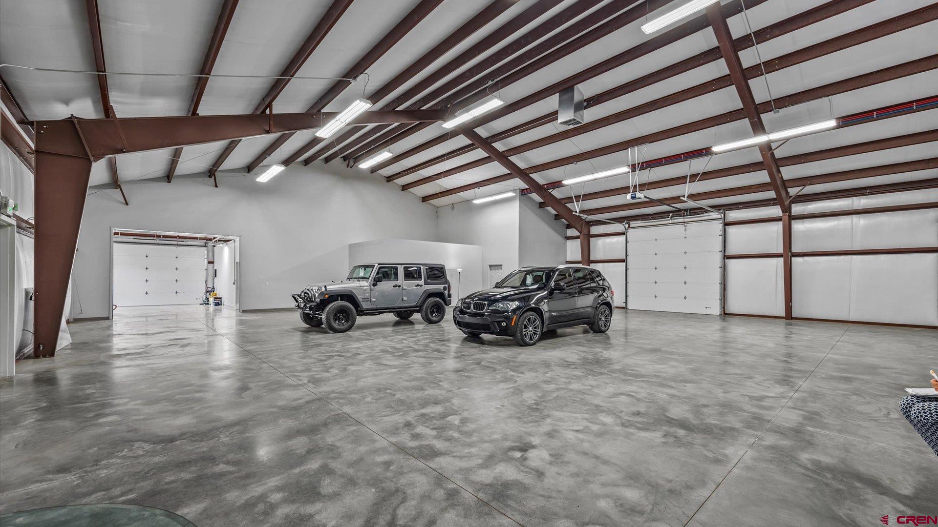 18222 6300th Road Montrose, CO 81403 - Photo 43 of 45 a view of a garage with parked cars