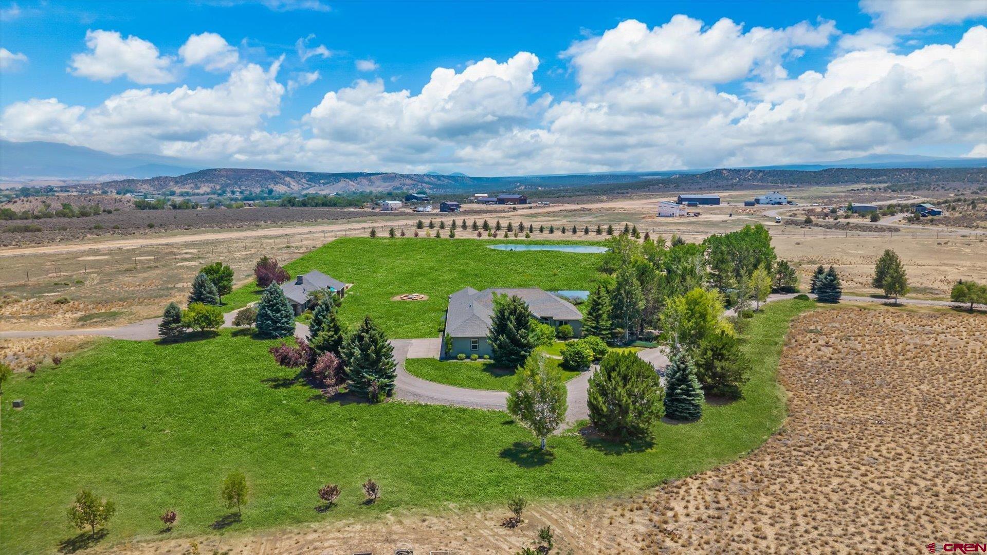 18222 6300th Road Montrose, CO 81403 - Photo 45 of 45 a view of a lake with a big yard