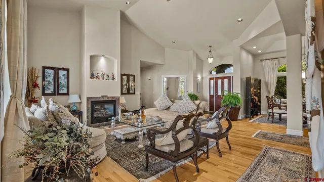 a living room with furniture a fireplace and a rug