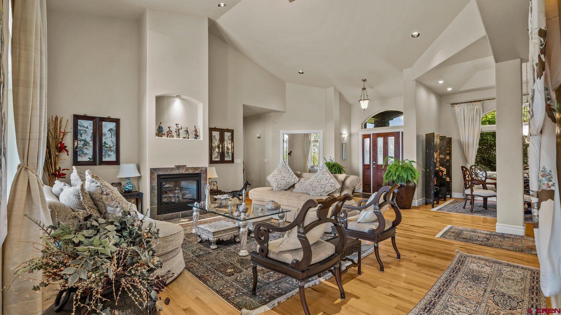 18222 6300th Road Montrose, CO 81403 - Photo 7 of 45 a living room with furniture a fireplace and a rug