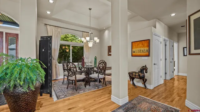 a view of a livingroom with furniture window and wooden floor