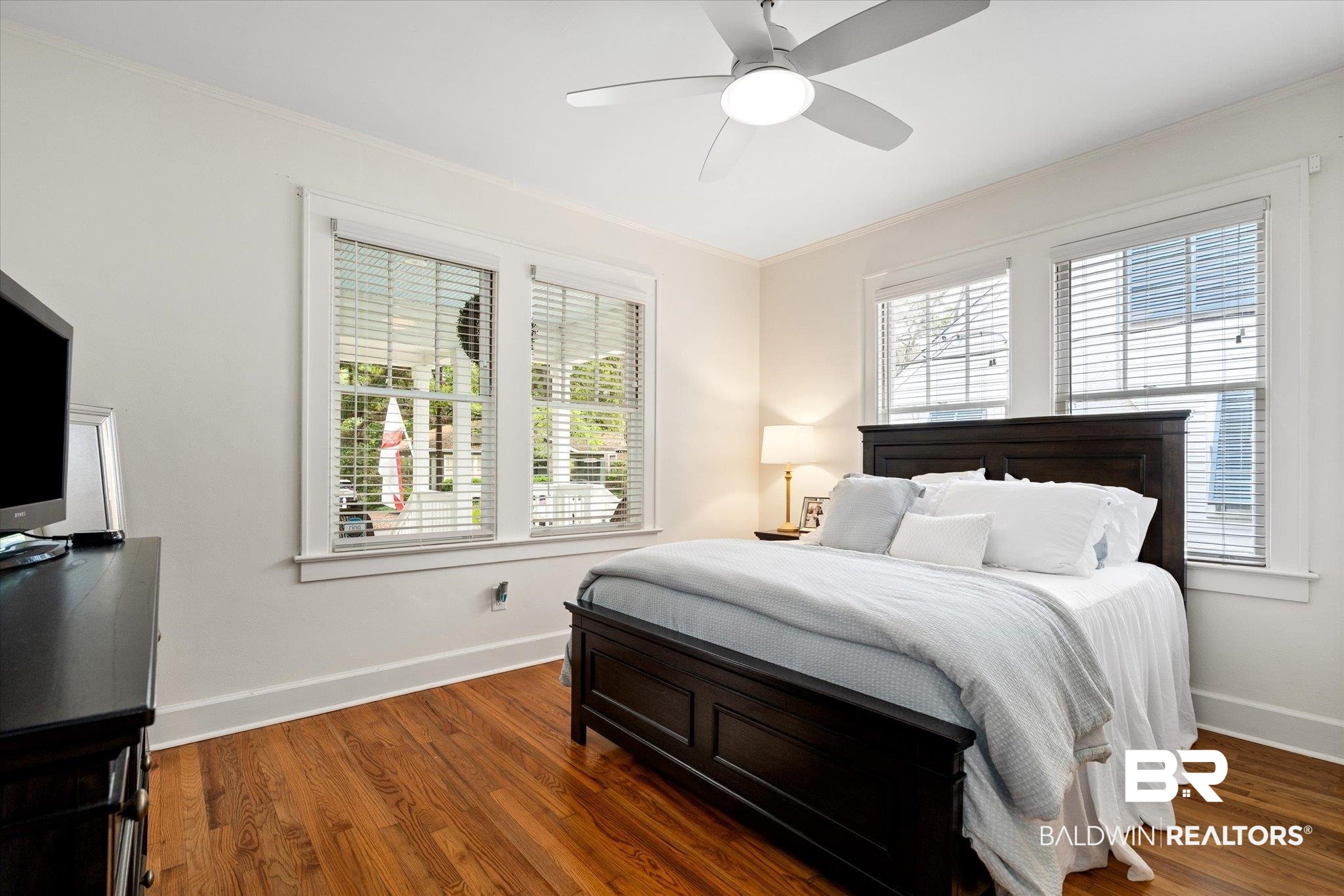 112 Crenshaw Street Mobile, AL 36606 - Photo 14 of 21 Bedroom featuring crown molding, baseboards, ceiling fan, and wood finished floors