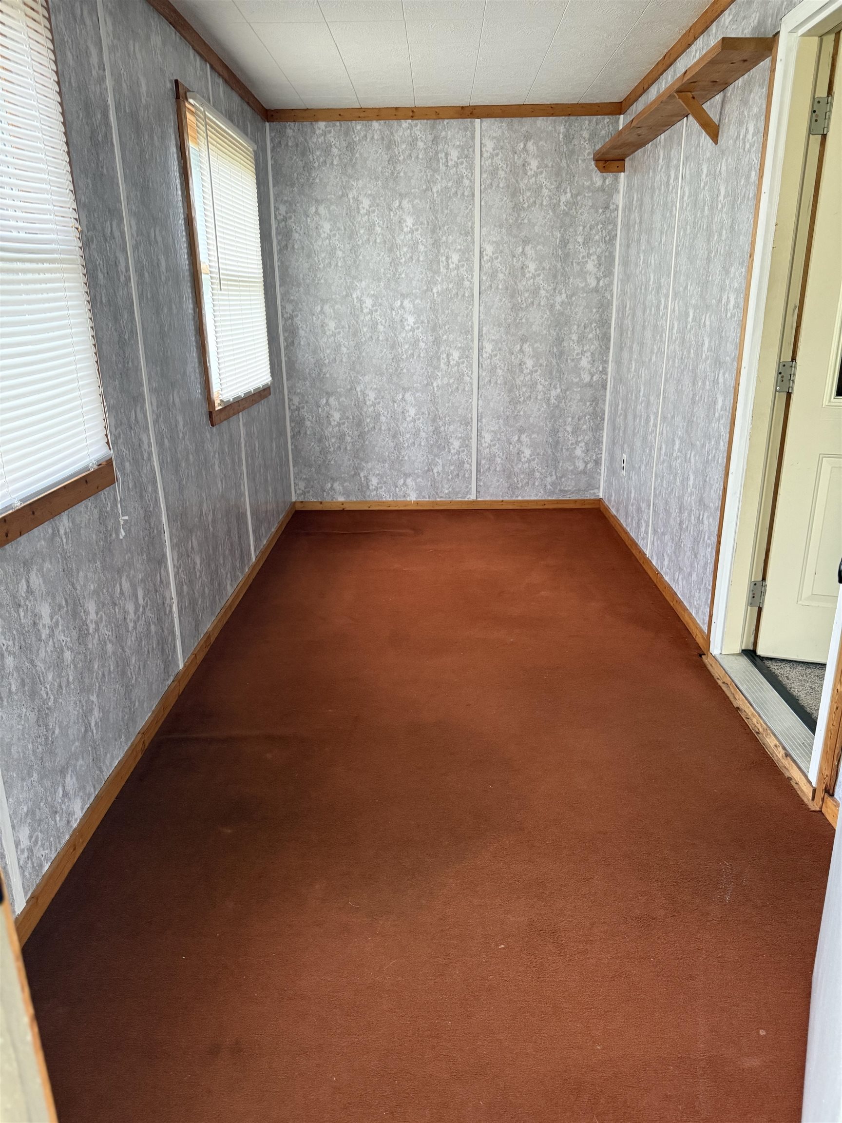 311 East Front Street Byron, IL 61010 - Photo 11 of 15 a view of an empty room with a window
