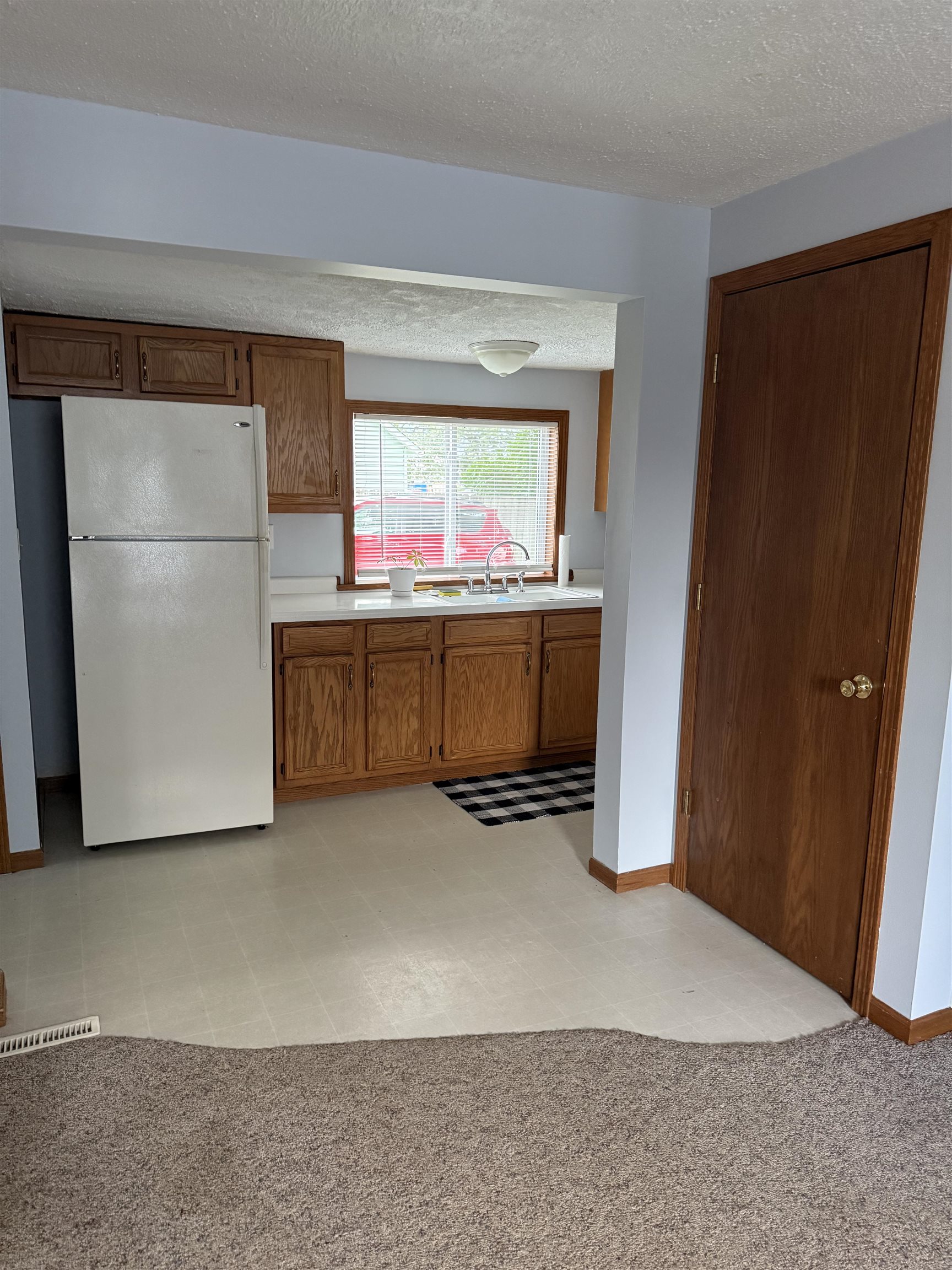 311 East Front Street Byron, IL 61010 - Photo 8 of 15 a kitchen with stainless steel appliances a refrigerator and a microwave
