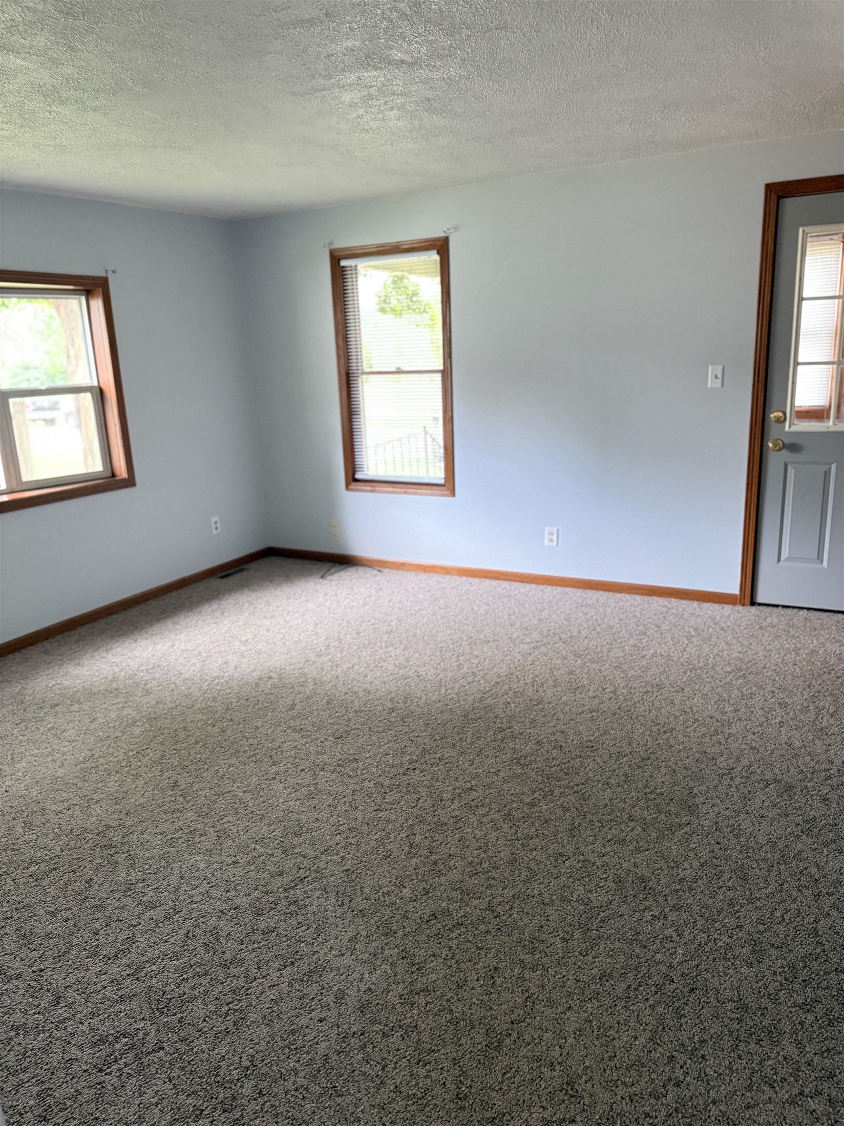 311 East Front Street Byron, IL 61010 - Photo 9 of 15 an empty room that has a window