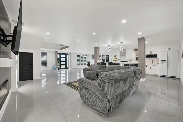 a view of kitchen with furniture and a refrigerator