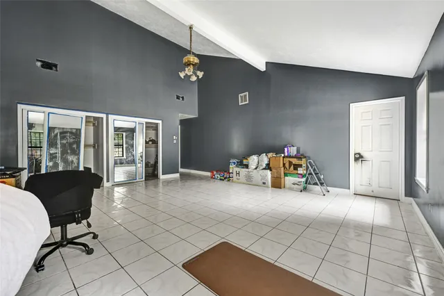a view of a livingroom with furniture and a ceiling fan