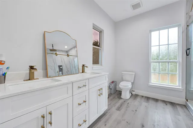 a room with a bed and a cabinets