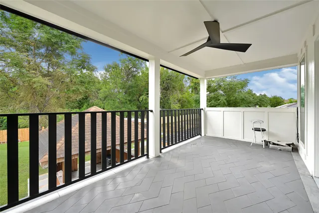 a view of railway station with lots of trees in the background