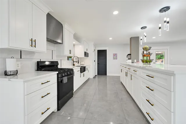 a large kitchen with cabinets
