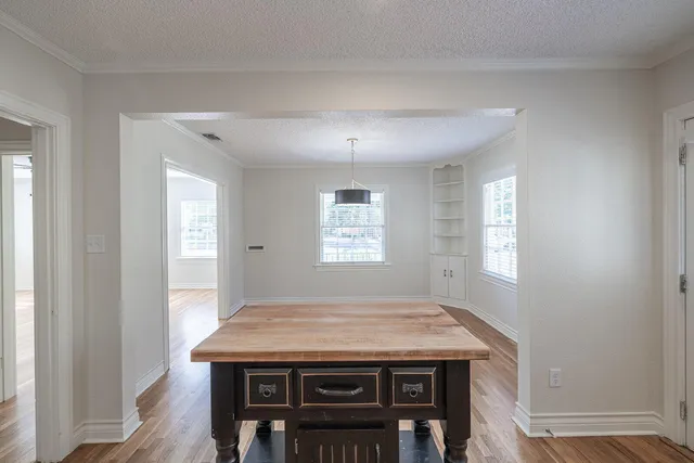 a view of an empty room with wooden walls