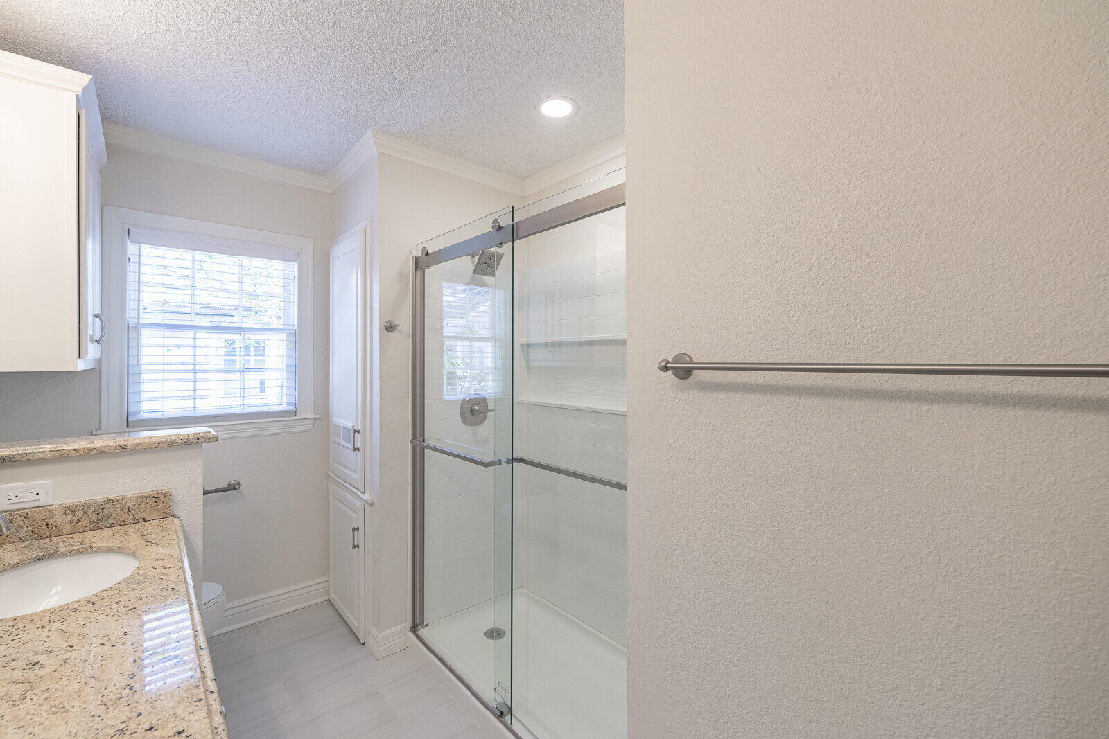 2810 24th Street Lubbock, TX 79410 - Photo 25 of 47 a bathroom with a shower and a sink