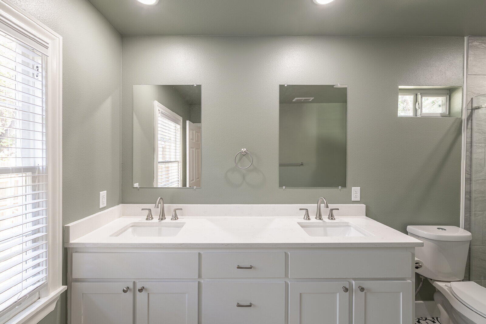 2810 24th Street Lubbock, TX 79410 - Photo 34 of 47 a bathroom with 2 sink and a mirror