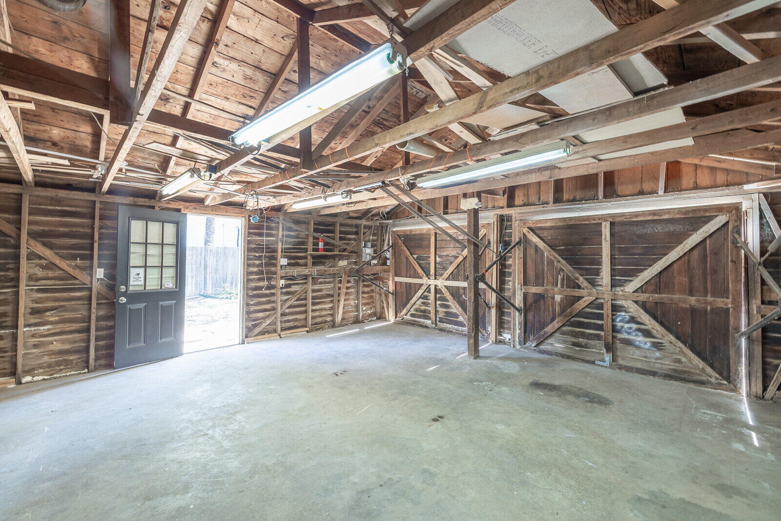2810 24th Street Lubbock, TX 79410 - Photo 44 of 47 a view of an empty room with wooden walls