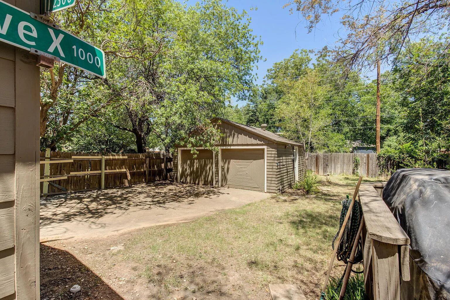 2810 24th Street Lubbock, TX 79410 - Photo 46 of 47 a view of backyard with wooden fence and large trees