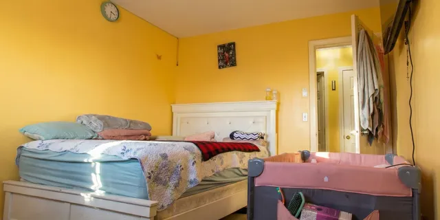 a bedroom with a bed and a table