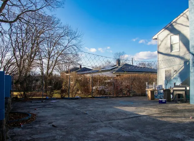 a view of a building with a yard
